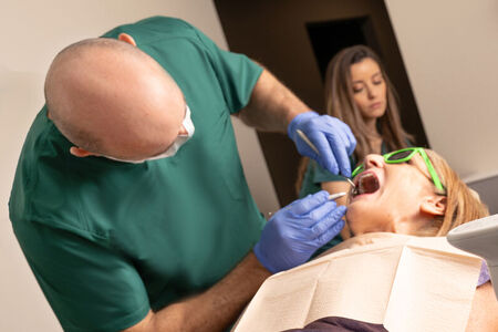 endodontist with patient