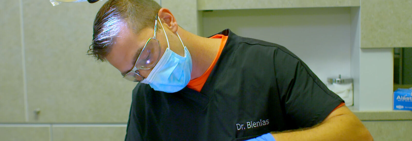 Dr. Blenias performing dental procedure